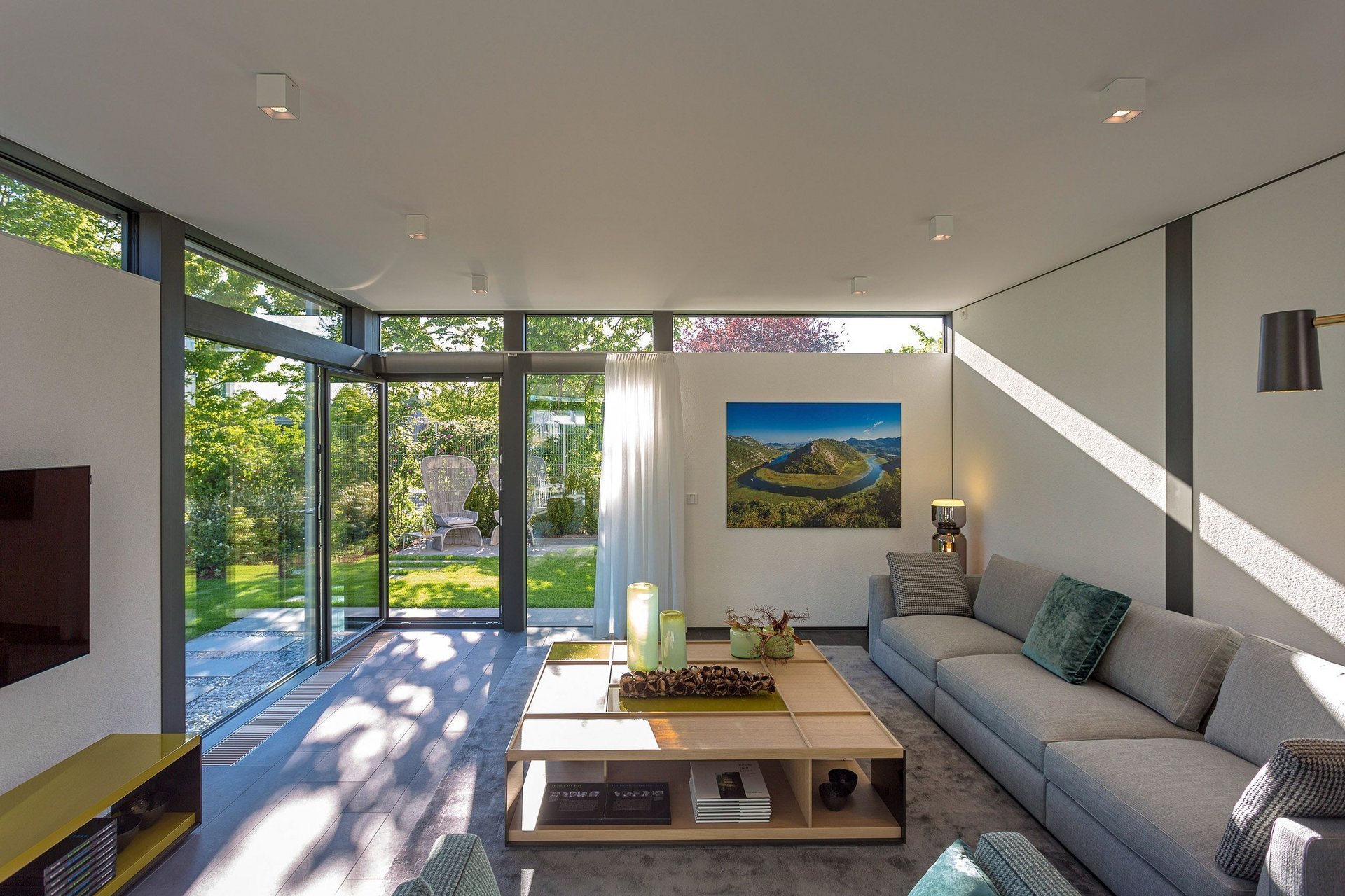 Spacious living room featuring a sleek design and natural light