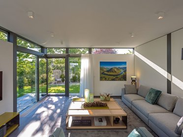 Spacious living room featuring a sleek design and natural light