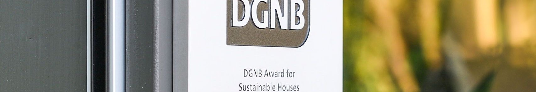 HUF Haus DGNB Award for Sustainable Projects DGNB award plaque on HUF Haus for sustainability excellence