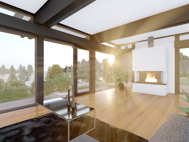 Helles Wohnzimmer mit Kamin und Blick ins Grüne